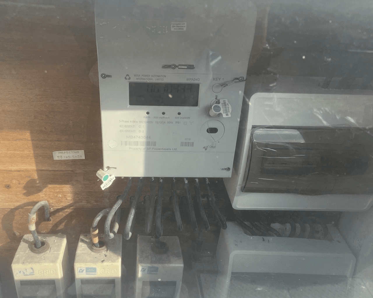 Three-phase electrical meter on a Singapore landed home